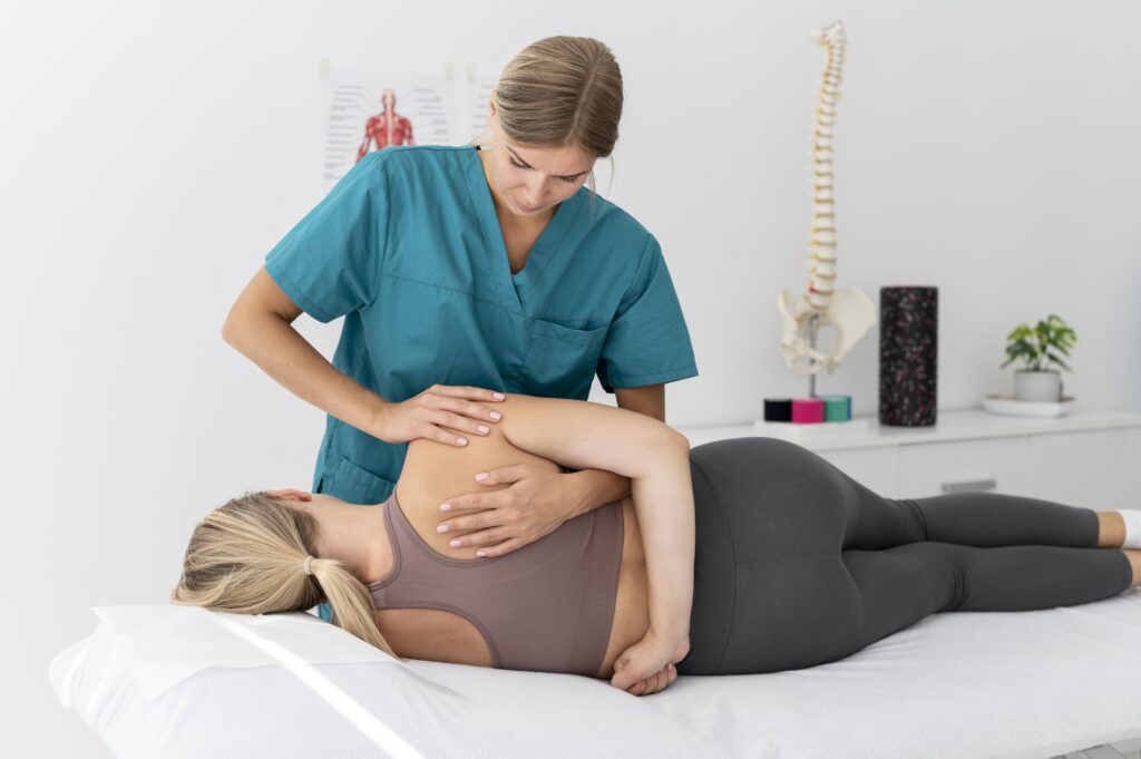 physiotherapist-helping-patient-her-clinic